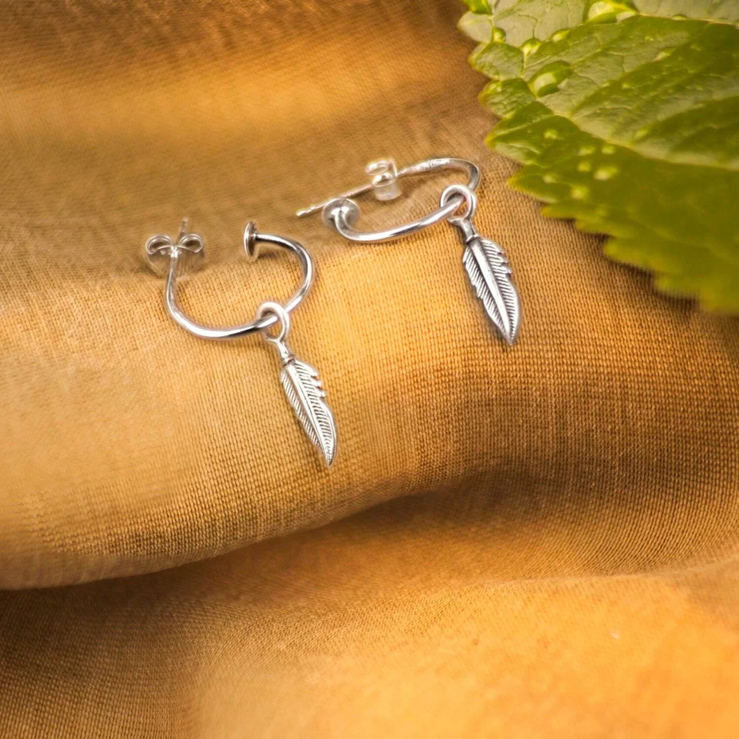 Open Hoop Earrings with Feather Charm in Sterling Silver