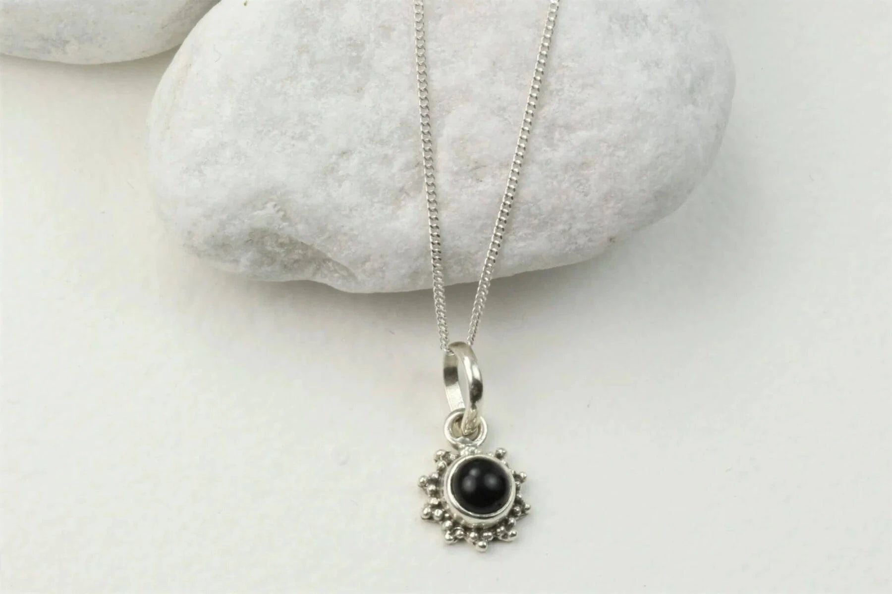 Star Motif Pendant Necklace with Black Onyx in Sterling Silver