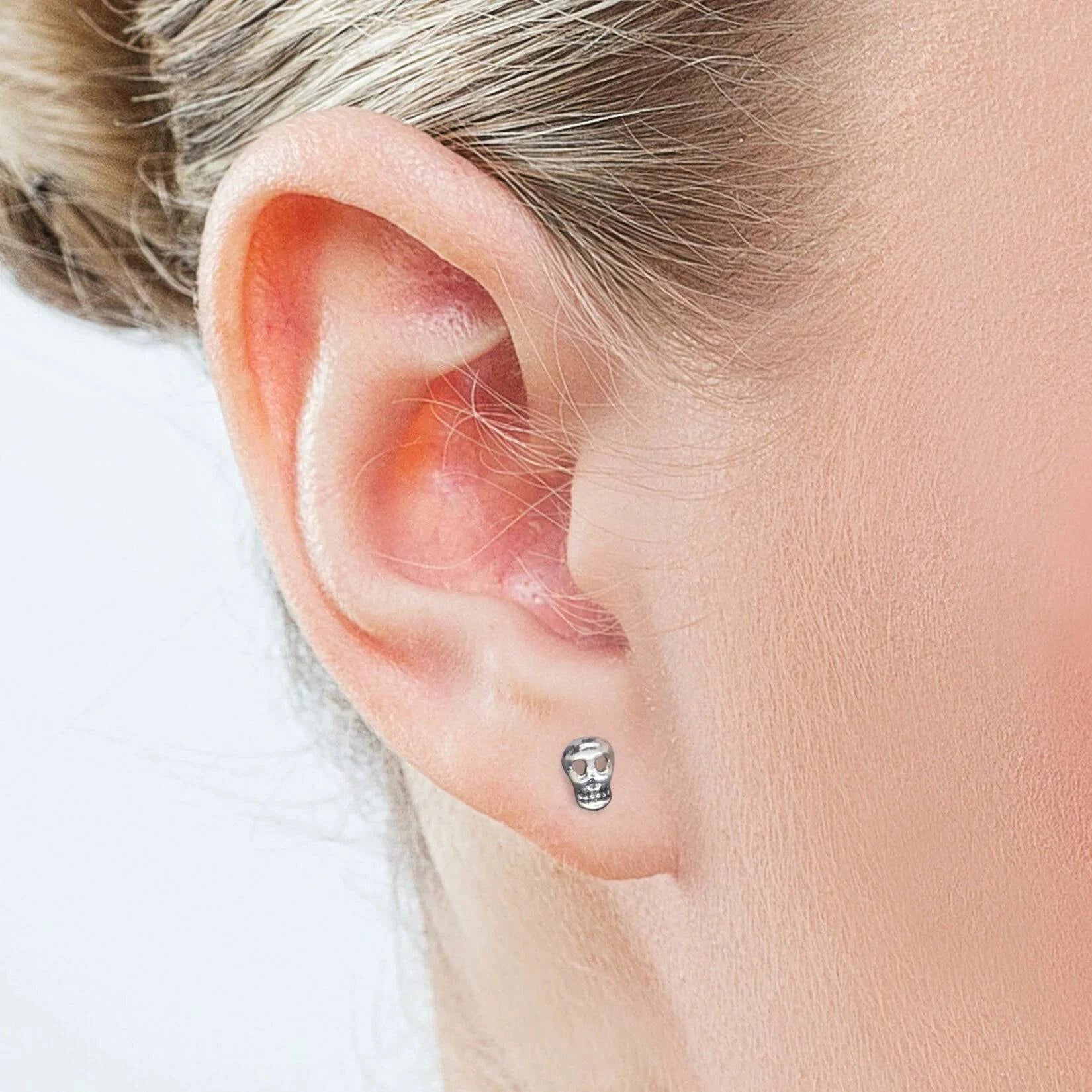 Skull Stud Earrings with Butterfly Fastening in Sterling Silver