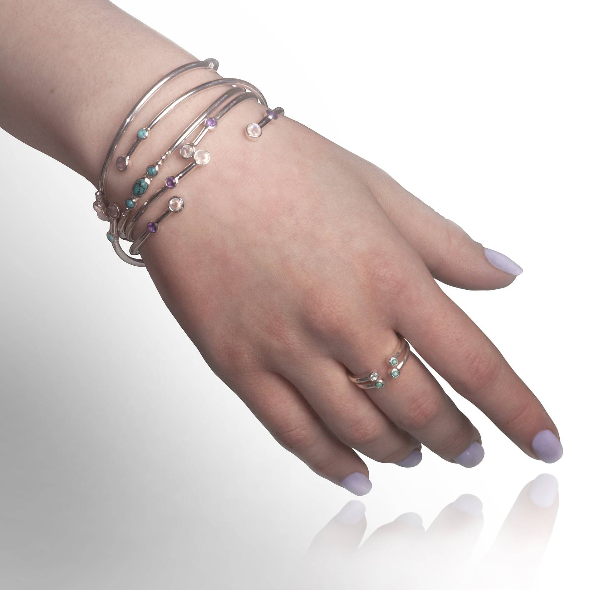 Silver Bangle Bracelets with gemstones on model hand